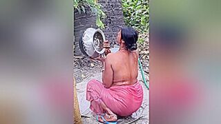 Horny Bhabhi-flaunting-her-assets-in-public-bath